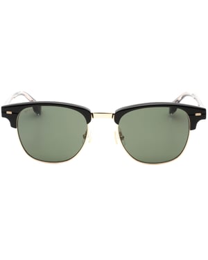 Hugo Boss Sonnenbrille mit grünen Gläsern und schwarzen Details in Gold