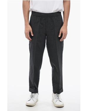 REM Slim Fit Hose aus zerknitterter Baumwolle in Grau