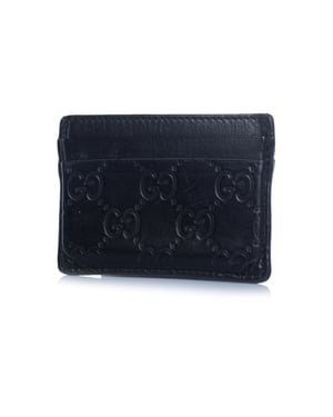 Gucci, schwarzer Leder-Kartenhalter mit Monogrammprägung