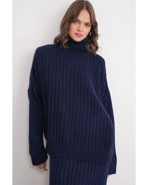 Übergroßer Rippstrick-Turtleneck-Pullover