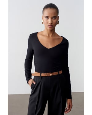 Schmale Passform V-Ausschnitt Strickbluse