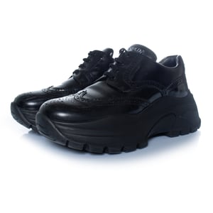Prada, klobige Brogue-Sneaker in Schwarz