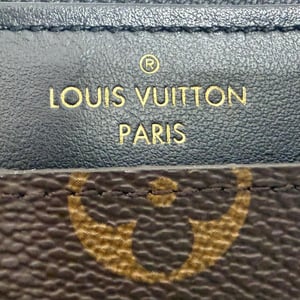 Louis Vuitton Monogram Canvas Slim Handtasche aus braunem Leder