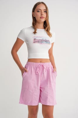 Hoch taillierte Baumwoll-Drawstring-Mini-Shorts