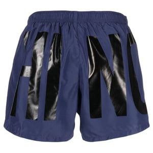Marineblaue kurze Badeshorts mit Print-Logo der Marke Moschino