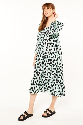 Grünes bedrucktes Kittelkleid