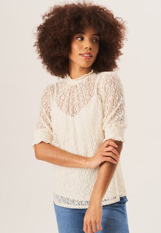 Blouse ample en dentelle à col haut