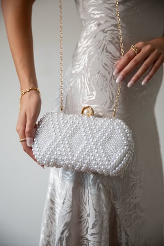 White beaded clutch bag