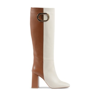 Brauner und weißer hoher lyrischer Stiefel