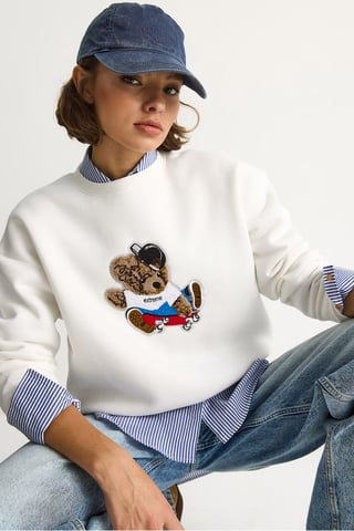 Bestickter Rundhals-Pullover mit langen Ärmeln