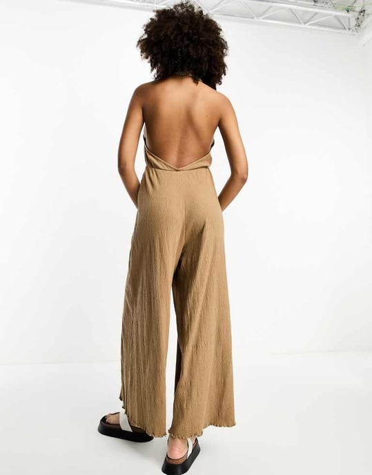 ASOS DESIGN crinkle jersey halter jumpsuit in mocha-Brown