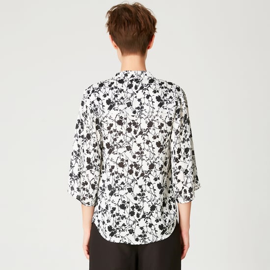 Tulip sleeves blouse with monochrome floral print and contrasting neckline