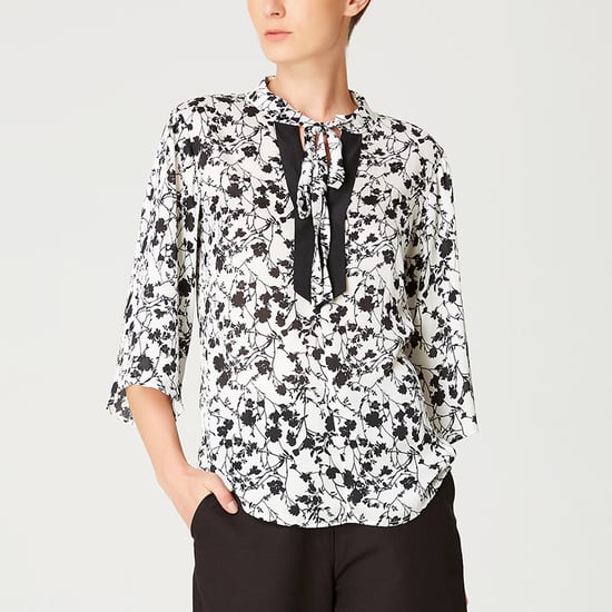 Tulip sleeves blouse with monochrome floral print and contrasting neckline