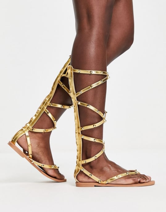 ASOS DESIGN Florida studded high leg gladiator flat sandals in gold