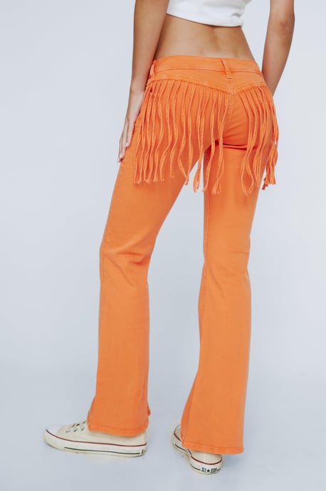 Petite Fringed Low Rise Flared Denim Jeans