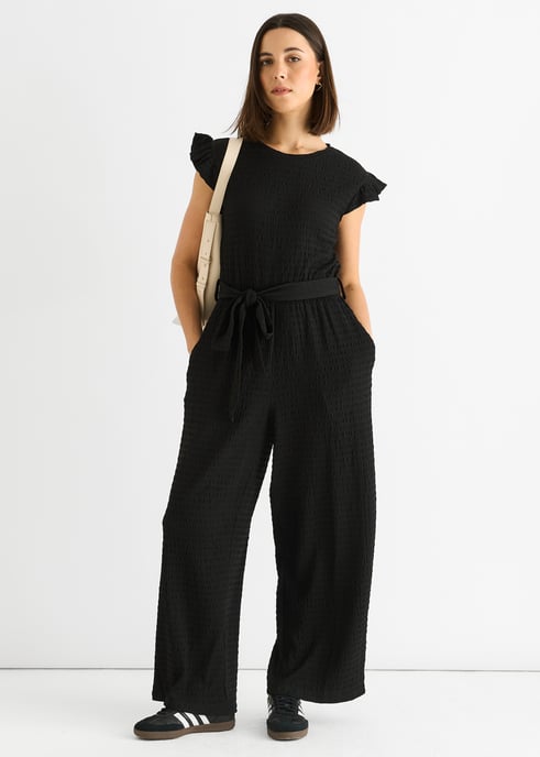 Schwarzer Jumpsuit mit elastischer Taille und Rüschen aus Stretch-Material - Image 1