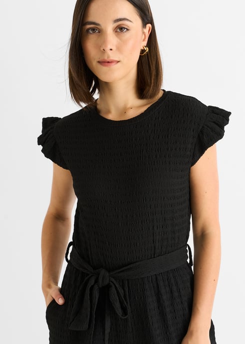 Schwarzer Jumpsuit mit elastischer Taille und Rüschen aus Stretch-Material - Image 2