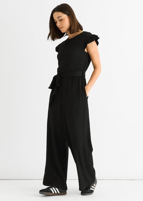 Schwarzer Jumpsuit mit elastischer Taille und Rüschen aus Stretch-Material - Image 3