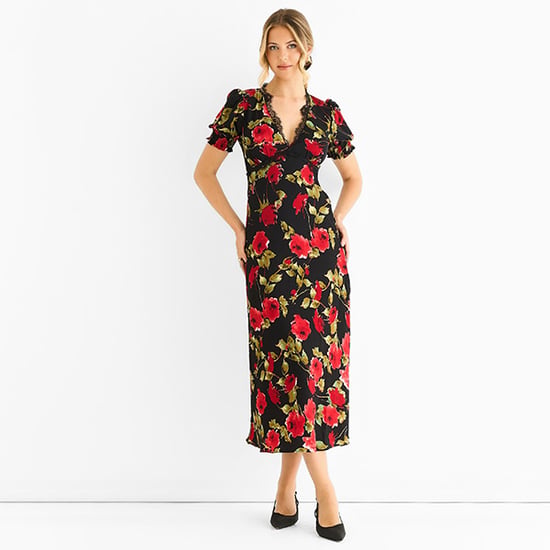 Schwarzes Midikleid mit floralen Spitzenverzierungen - Image 1