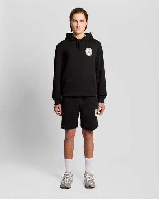 Grafisches Abzeichen Baumwoll-Sweatshorts - Image 1
