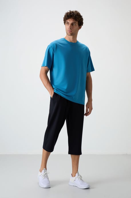 Herren Capri Shorts mit weitem Bein in Mittelhöhe - Image 1