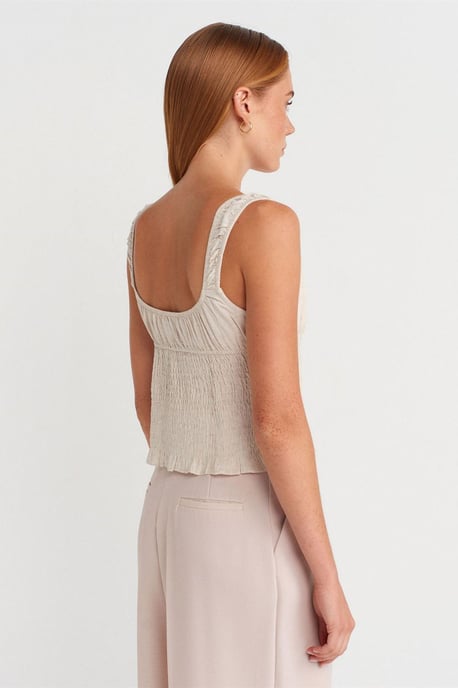 Taillierte ärmellose Bluse mit Knoten vorne - Image 2