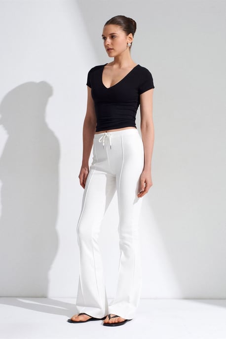 Hüfthohe Schlagjerseyhose mit Kordelzug - Image 1