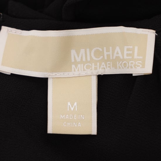 Michael Kors Jumpsuit mit Rüschen und Cut-Out-Schultern aus schwarzem Polyester - Image 4